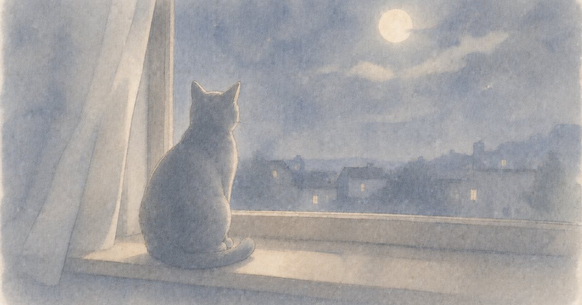 夜の窓辺で外を見る猫